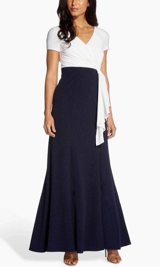 <p>Turn heads when you walk into any event in this stunning long dress. Featuring short sleeves V-neckline with a faux wrap bodice and gathered side. Perfect for church or evening affairs, this outfit will make you feel classy and confident on your bride's big day!</p> <p> </p> <p>Fabric : Stretch Crepe<br><br>Zipper Back<br><br>Length : Full Length<br><br>Sleeve Style : Short Sleeve<br><br>Color : Ivory Midnight<br><br>Sizes : 12, 14, 16<br><br>Fully Lined<br><br>Occasion : Formal, Evening Party, Church, Wedding Guest, Mother of the Bride</p>