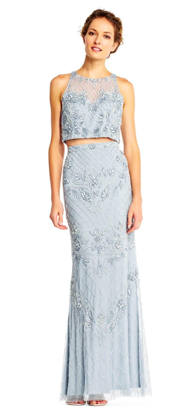 This stunning two piece set floor length dress features a halter crop top with all over beaded details and an illusion sweetheart neckline. The matching sheath skirt has the same beaded details, a high waist, and a flared hem.  Perfect for formal, evening party or any special occasion.<br><br><br>Fabric : Mesh<br><br>Closure : Zipper Back<br><br>Length : Full Length<br><br>Sleeve Style : Halter<br><br>Color :  Blue Heather<br><br>Sizes : 0, 2, 8, 12, 16<br><br>Fully Lined<br><br>Soft Cup Inserts<br><br>Occasion : Formal, Prom, Homecoming, Wedding Guest, Evening Party, Red Carpet, Pageant, Special Occasion