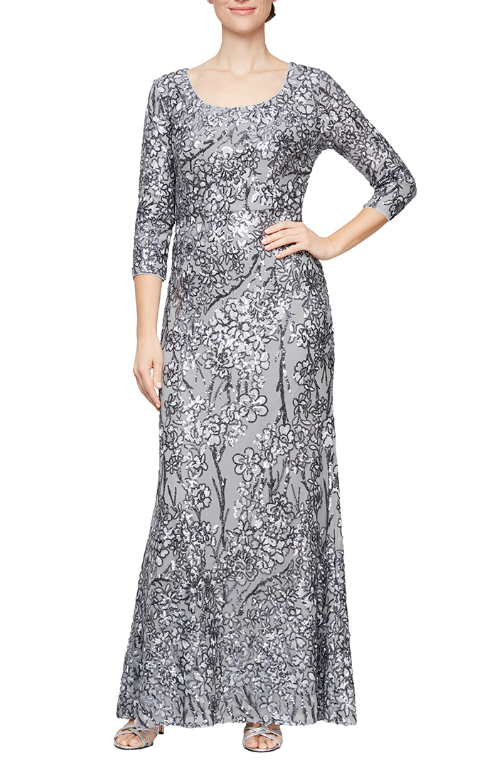 <p> </p> <p><span>This stunning long dress features a 3/4 sleeve scoop neckline. Fit and flare silhouette in sequin detail.  This dress is perfect for any special occasion.</span></p> <p><span>Sleeve Style : 3/4 Sleeve</span></p> <p><span>Length : Full Length</span></p> <p><span>Color : Silver</span></p> <p><span>Size : 14, 16, 18</span></p> <p><span>Fully Lined</span></p> <p><span>Soft Cup Inserts</span></p> <p><span>Occasion : Formal, Mother of the Bride, Mother of the Groom, Church, Wedding Guests</span></p>