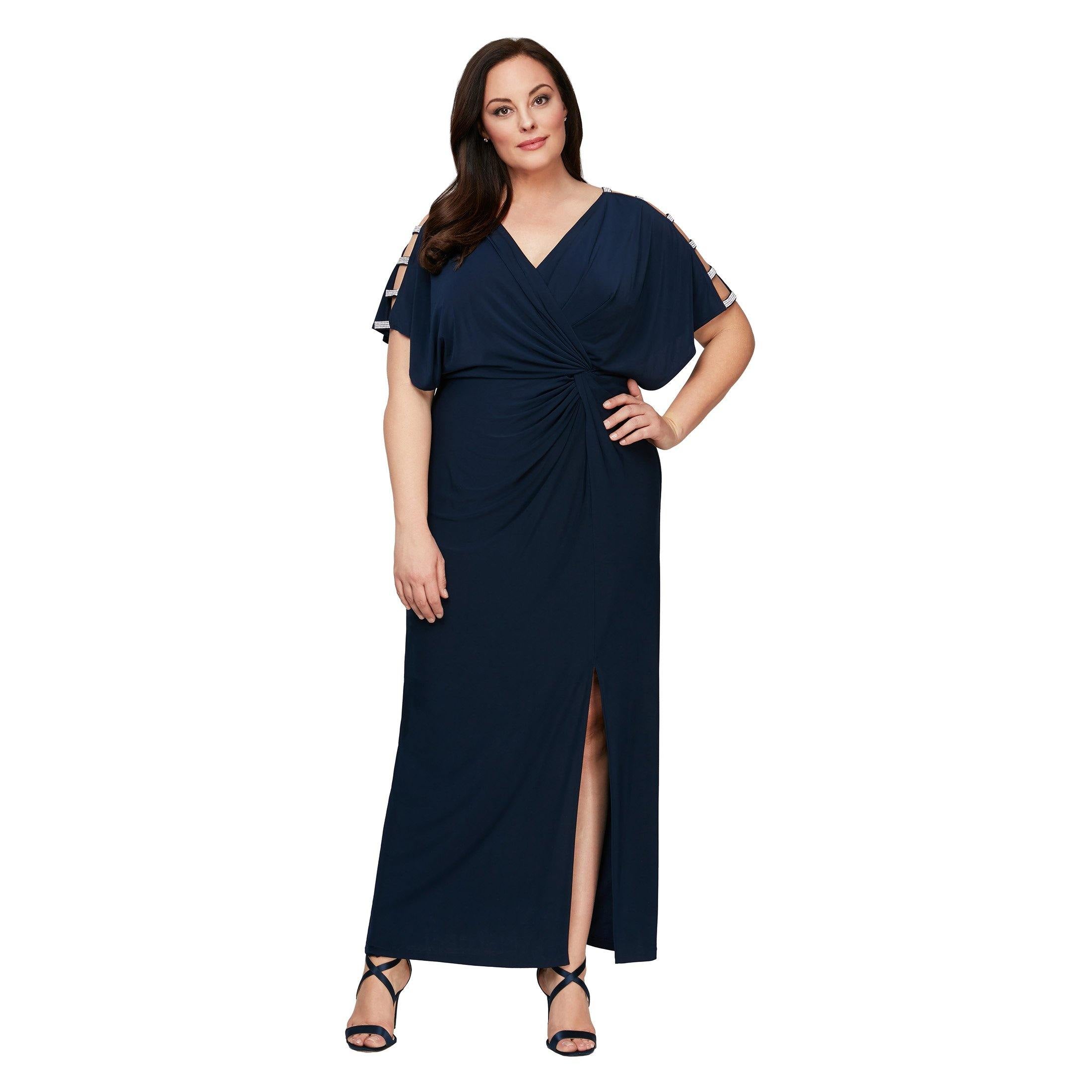 This stunning mother of the bride long dress features a short sleeve v-neckline with tied waist and a sheath skirt with slits in the legs. Perfect for any special occasion.<br data-mce-fragment="1"><br data-mce-fragment="1"><br data-mce-fragment="1">Fabric : Matte Jersey<br data-mce-fragment="1"><br data-mce-fragment="1">Zipper Back<br data-mce-fragment="1"><br data-mce-fragment="1">Length : Full Length<br data-mce-fragment="1"><br data-mce-fragment="1">Sleeve Style : Short Sleeve<br data-mce-fragment="1"><br data-mce-fragment="1">Color : Navy, Dark Royal<br data-mce-fragment="1"><br data-mce-fragment="1">Sizes : 14W, 16W, 18W, 20W, 22W, 24W<br data-mce-fragment="1"><br data-mce-fragment="1">Fully Lined<br data-mce-fragment="1"><br data-mce-fragment="1">Soft Cup Inserts<br data-mce-fragment="1"><br data-mce-fragment="1">Occasion : Formal, Mother of the Bride, Mother of the Groom, Church, Wedding Guests