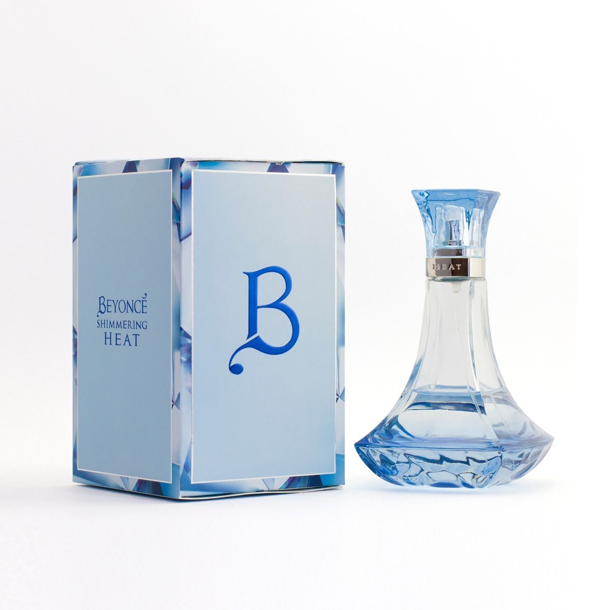 Beyoncé Shimmering Heat is a floral woody musk fragrance with a spectacular blend of rich florals and sexy woods. The rare Blue Mystique Orchid electrifies the exotic bouquet heart and adds a radiant elegance.