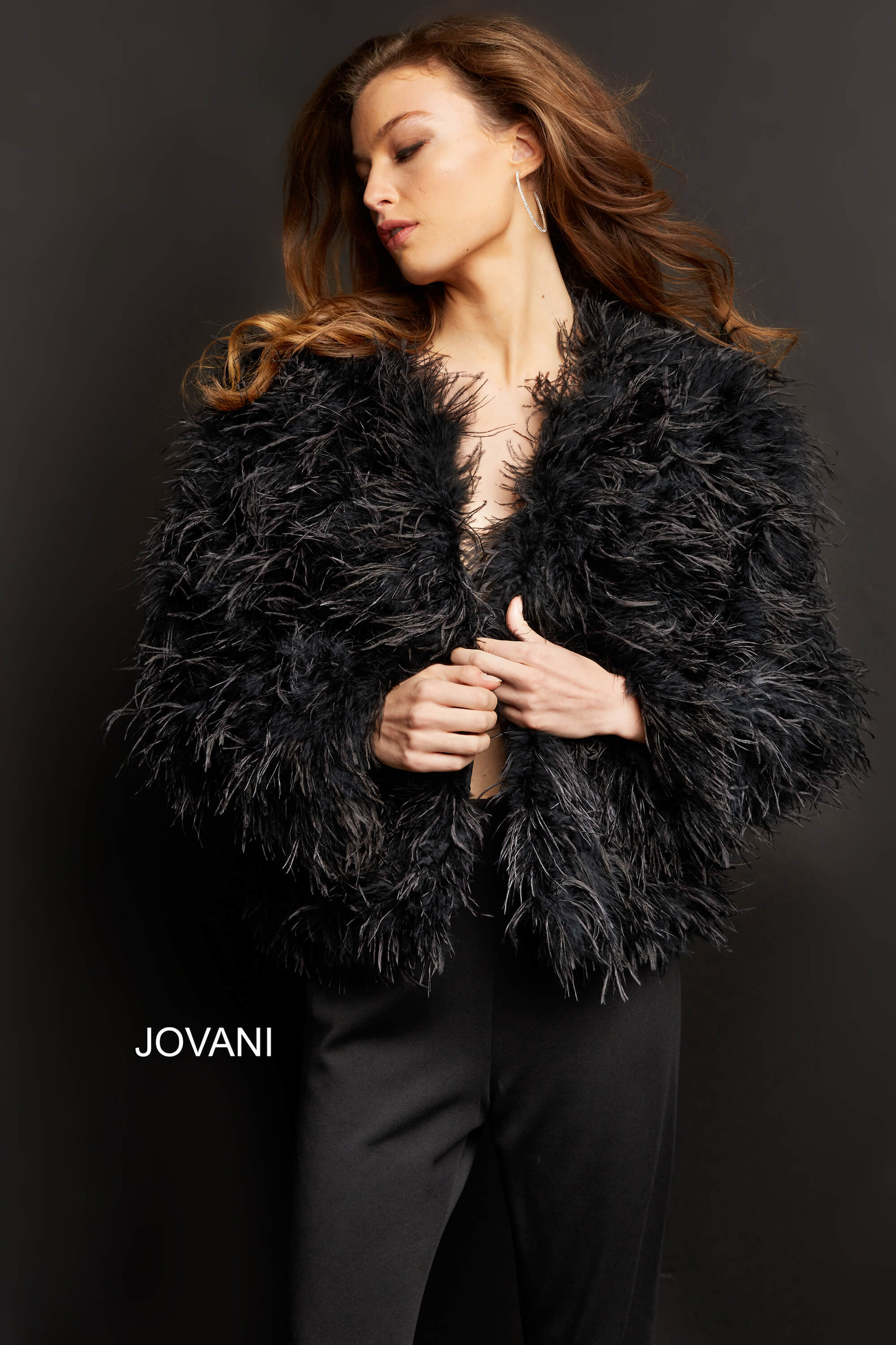 <li>
<strong>Details: </strong>Black on-trend ostrich feather ready to wear lined jacket with full length sleeves, open front and hip length, button front closure</li>