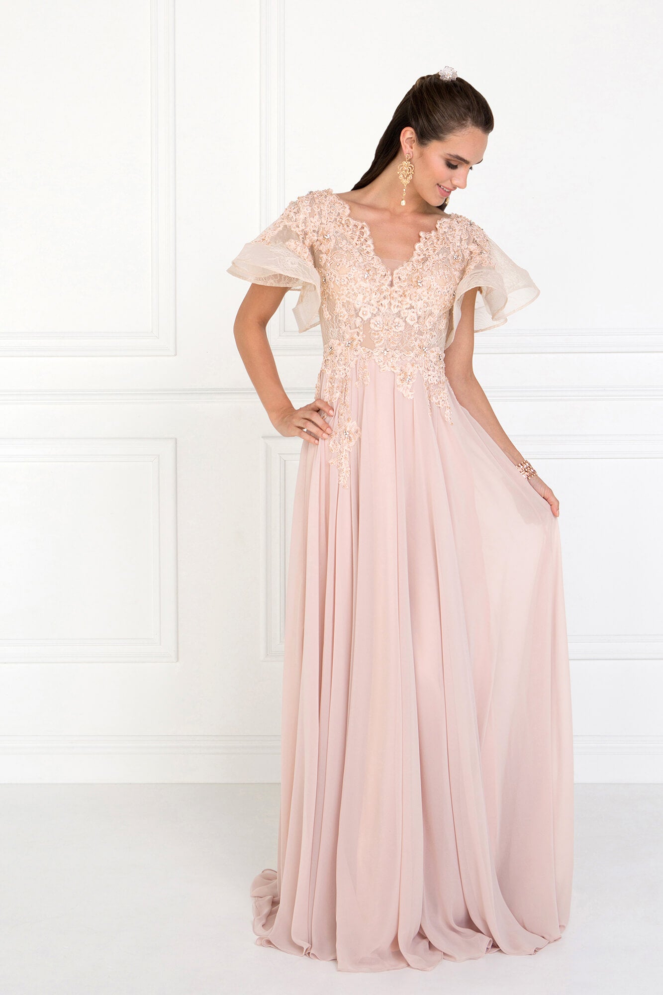 <p><br><span>Festooned with jeweled floral lace appliques trailing down the bodice, this impeccable piece flaunts a plunging, wide v-neckline framed with fluttering short butterfly sleeves. Designed with a scooped illusion back, the soft chiffon skirt is fashioned with an A-line effect and lush shirring for a flared look and a court train.</span></p> <p> </p> <p>Fabric : Chiffon<br><br>Closure : Back Zipper<br><br>Sleeve Style : Short Sleeve<br><br>Color : Champagne<br><br>Sizes : S, M, L, XL, 2XL, 3XL, 4XL<br><br>Fully Lined<br><br>Occasion : Formal, Prom, Homecoming, Special Occasion</p>