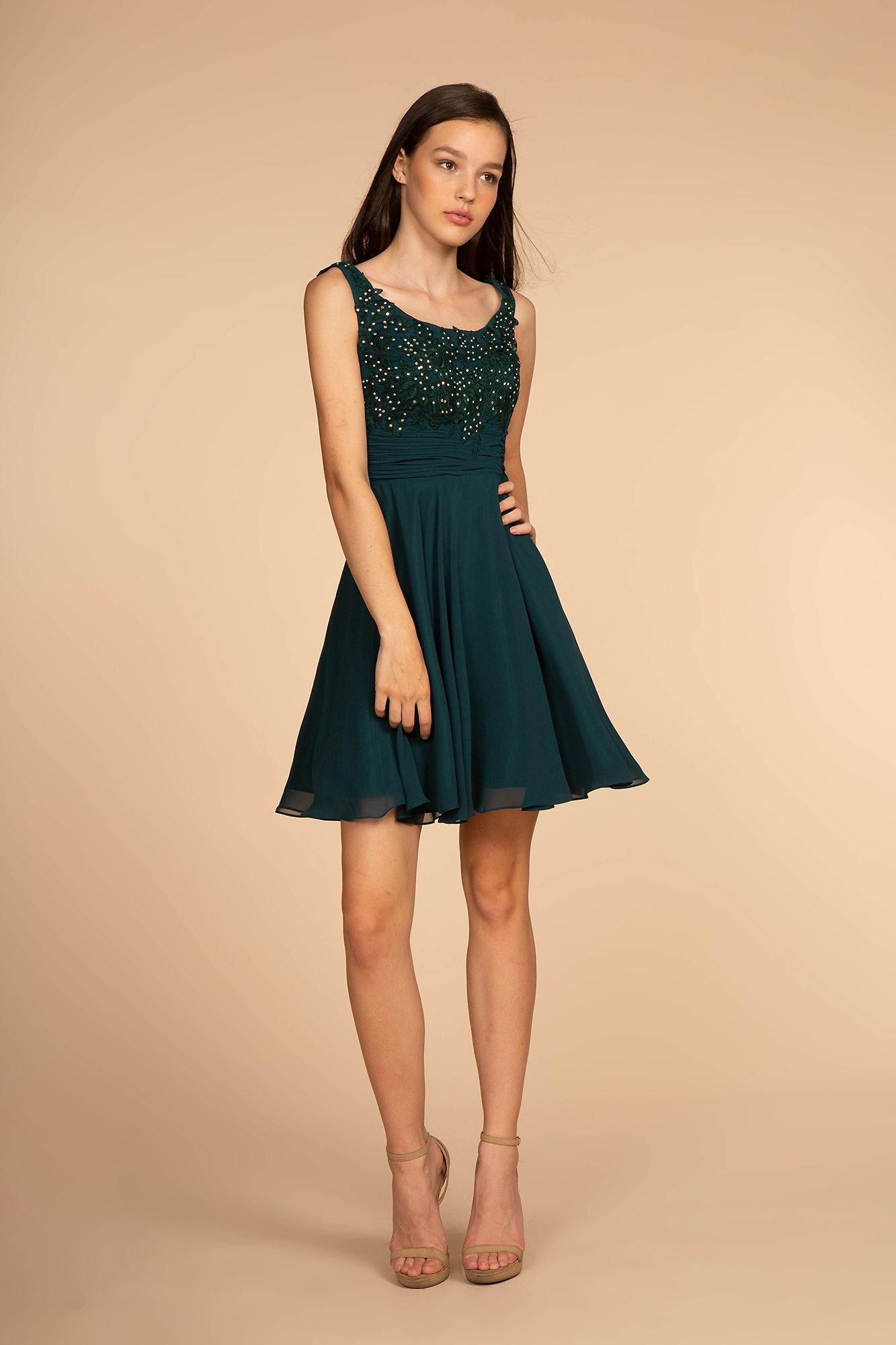 <p> </p> <p>This elegant short dress features a sleeveless boat neckline. <span>A-line dress with embroidered lace applique bodice. This dress is perfect for any special occasion.</span></p> <p> </p> <p>Fabric : Chiffon</p> <p>Closure : Back Zipper</p> <p>Length : Above Knee/Mini</p> <p>Sleeve Style : Sleeveless</p> <p>Complimentary Matching Shawl Included</p> <p>Colors : Mauve, Teal</p> <p>Sizes : XS, S, M, L, XL, 2XL, 3XL, 4XL</p> <p>Fully Line</p> <p>Soft Cup Inserts</p> <p>Occasion : Formal, Prom, Homecoming, Evening Party</p>