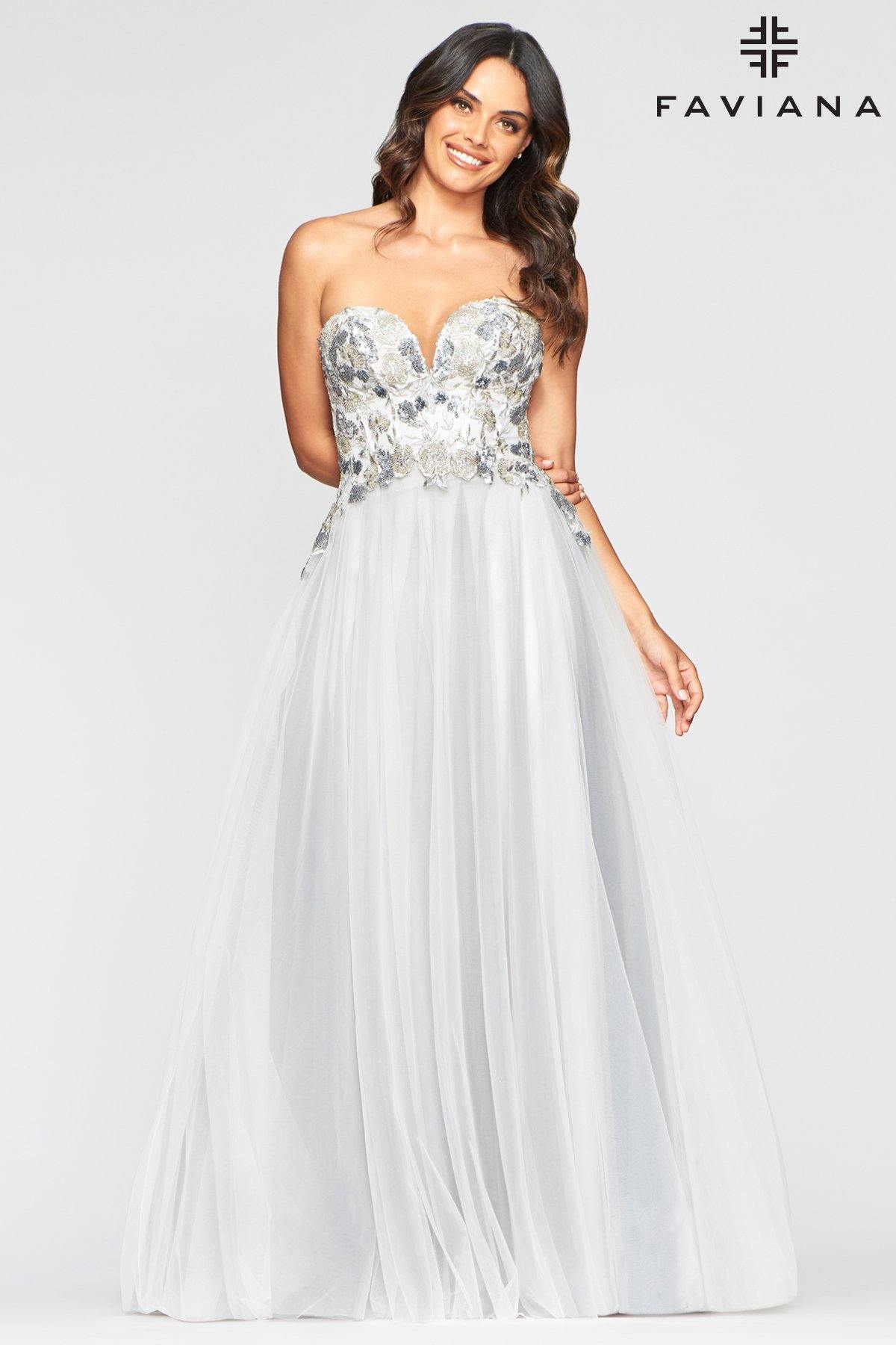 <p>This stunning A-line floor length dress features a strapless sweetheart neckline with corset back. The sheer fitted bodice is decorated with lace appliques. Perfect for any occasion. <br><br><br>Fabric : Tulle<br><br>Closure : Corset Back</p> <p>Length : Full Length<br><br>Sleeve Style : Strapless<br><br>Color : Ivory/Grey<br><br>Sizes : 00, 0, 2, 4, 6, 8, 10, 12, 14, 16<br><br>Fully Lined<br><br>Soft Cup Inserts<br><br>Occasion : Formal, Prom, Homecoming, Wedding Guest, Evening Party, Red Carpet, Pageant, Special Occasion</p>