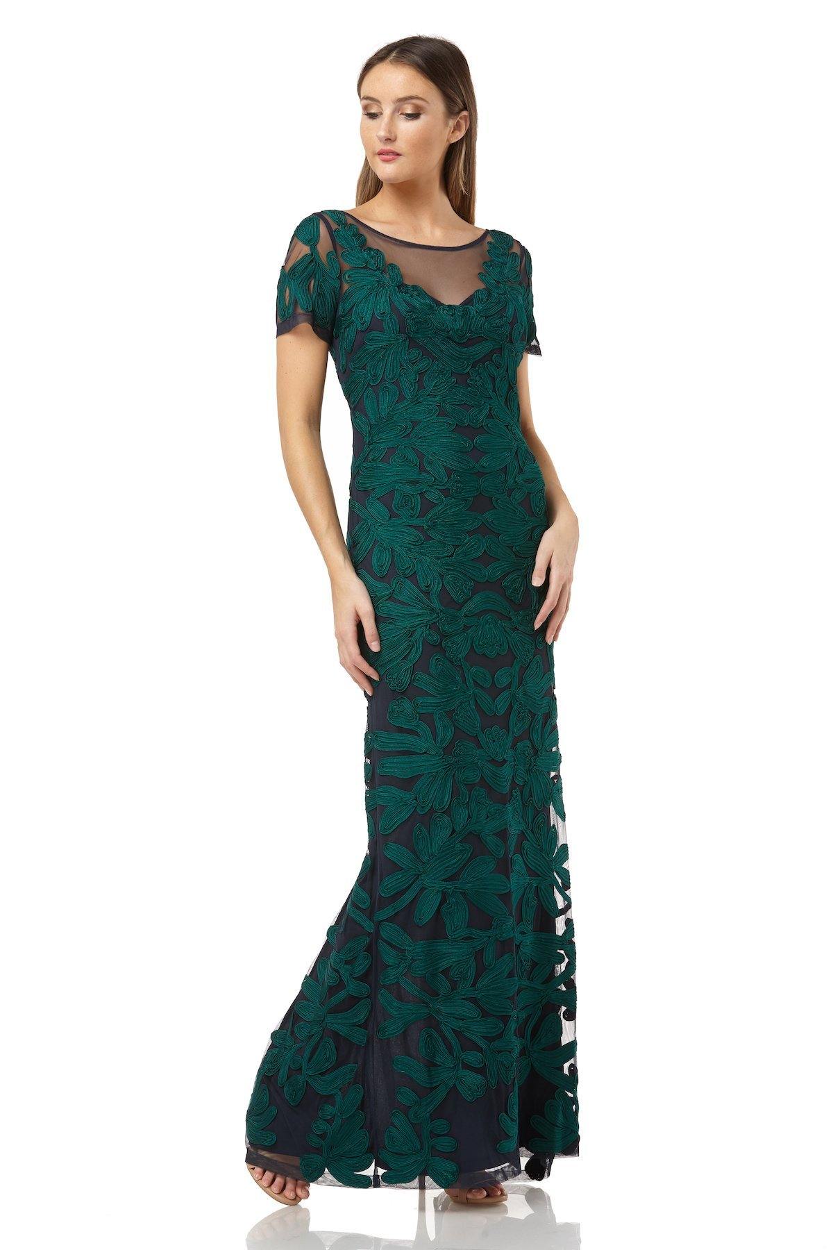 This elegant evening gown with an illusion neckline. Stunningly crafted in beautifully embroidered soutache this long dress features a flowing neckline and short sleeves while showing off a V-shaped back. The skirt features a full-height cover silhouette with a high slit at the back for more legroom. Perfect for any special occasion.<br data-mce-fragment="1"><br data-mce-fragment="1"><br data-mce-fragment="1">Fabric : Mesh<br data-mce-fragment="1"><br data-mce-fragment="1">Zipper Back<br data-mce-fragment="1"><br data-mce-fragment="1">Length : Full Length<br data-mce-fragment="1"><br data-mce-fragment="1">Sleeve Style : Short Sleeve<br data-mce-fragment="1"><br data-mce-fragment="1">Colors : Jade Navy, Navy, Antique Rose<br data-mce-fragment="1"><br data-mce-fragment="1">Sizes : 10, 12, 14, 16<br data-mce-fragment="1"><br data-mce-fragment="1">Fully Lined<br data-mce-fragment="1"><br data-mce-fragment="1">Occasion : Formal, Evening Party, Mother of the Bride, Mother of the Groom, Church, Wedding Guest