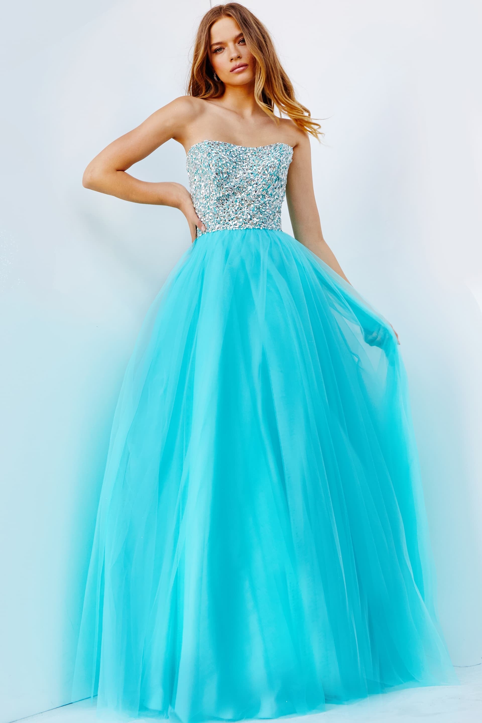 <li>
<strong>Closure</strong>: Invisible Back Zipper. Hook and Eye Closure.<br> </li><li>
<strong>Details</strong>: Blush embellished prom ballgown with a straight neckline and strapless fitted bodice, floor-length A-line flared and pleated skirt with sheer overlay.<br> </li><li><font size="2"><font face="georgia," serif><strong>Fit</strong>: The Model is 5'9  Wearing 3  Heels.</font></font></li><li><font size="2"><font face="georgia," serif><strong>Neckline</strong>: Straight</font></font></li><li><font size="2"><font face="georgia," serif><strong>Waistline</strong>: Natural</font></font></li><li><font size="2"><font face="georgia," serif>  JVN52131</font></font></li>