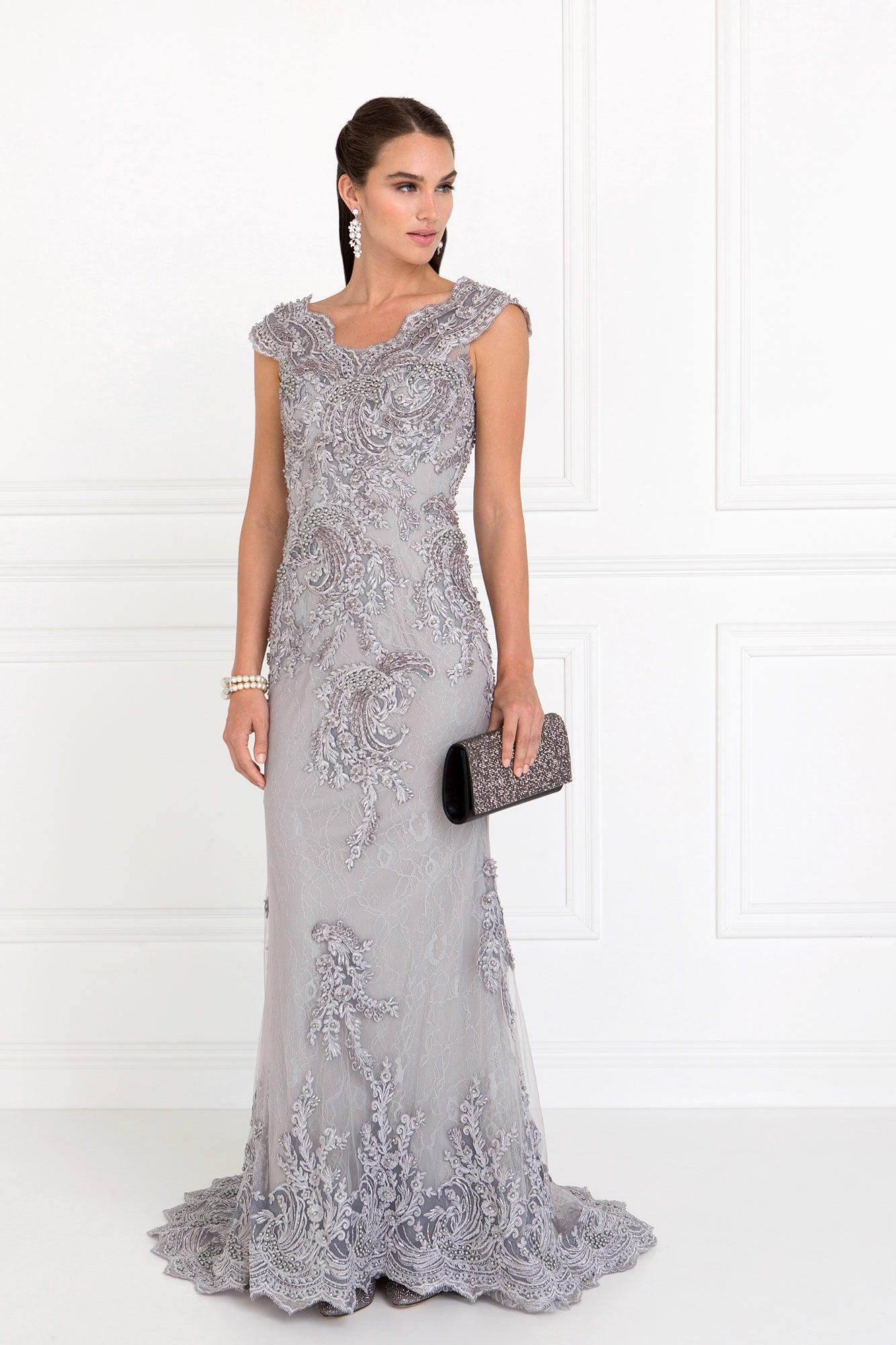 <p> </p> <p><span>This gorgeous long dress features a scalloped V-neckline with cap sleeves, the fitted bodice is designed with lace embroidery and a back zipper closure. The skirt has a slim fitting silhouette and finishes in a sweep train for added drama. </span><span>This dress is perfect for any special occasion.</span></p> <p> </p> <p>Fabric : Lace</p> <p>Closure : Back Zipper</p> <p>Sleeve Style : Cap Sleeve</p> <p>Colors : Silver, Mauve</p> <p>Sizes : XS, S, M, L, XL, 2XL, 3XL</p> <p>Fully Lined</p> <p>Occasion : Formal, Prom, Homecoming, Special Occasion</p> 