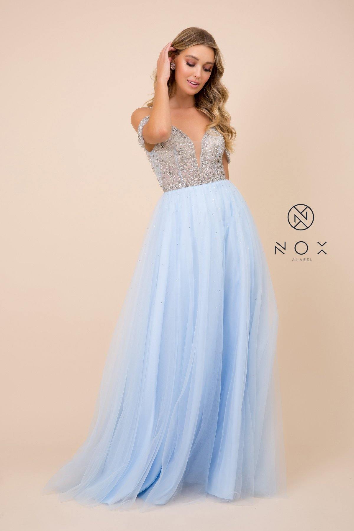 <p> </p> <p>This whimsical long dress features a b<span>eaded off shoulder bodice secured with spaghetti straps. Plunging neckline with modesty illusion panel. This dress is perfect for any special occasion.</span></p> <p><br></p> <p>Fabric : Tulle</p> <p>Closure : Back Zipper</p> <p>Length : Floor Length</p> <p>Sleeve Style : Off Shoulder</p> <p>Colors : Pink Tan, Light Blue</p> <p>Sizes : 4, 6, 8, 10, 12, 14</p> <p>Fully Line</p> <p>Soft Cup Inserts</p> <p>Occasion : Formal, Prom, Homecoming, Evening Party</p>