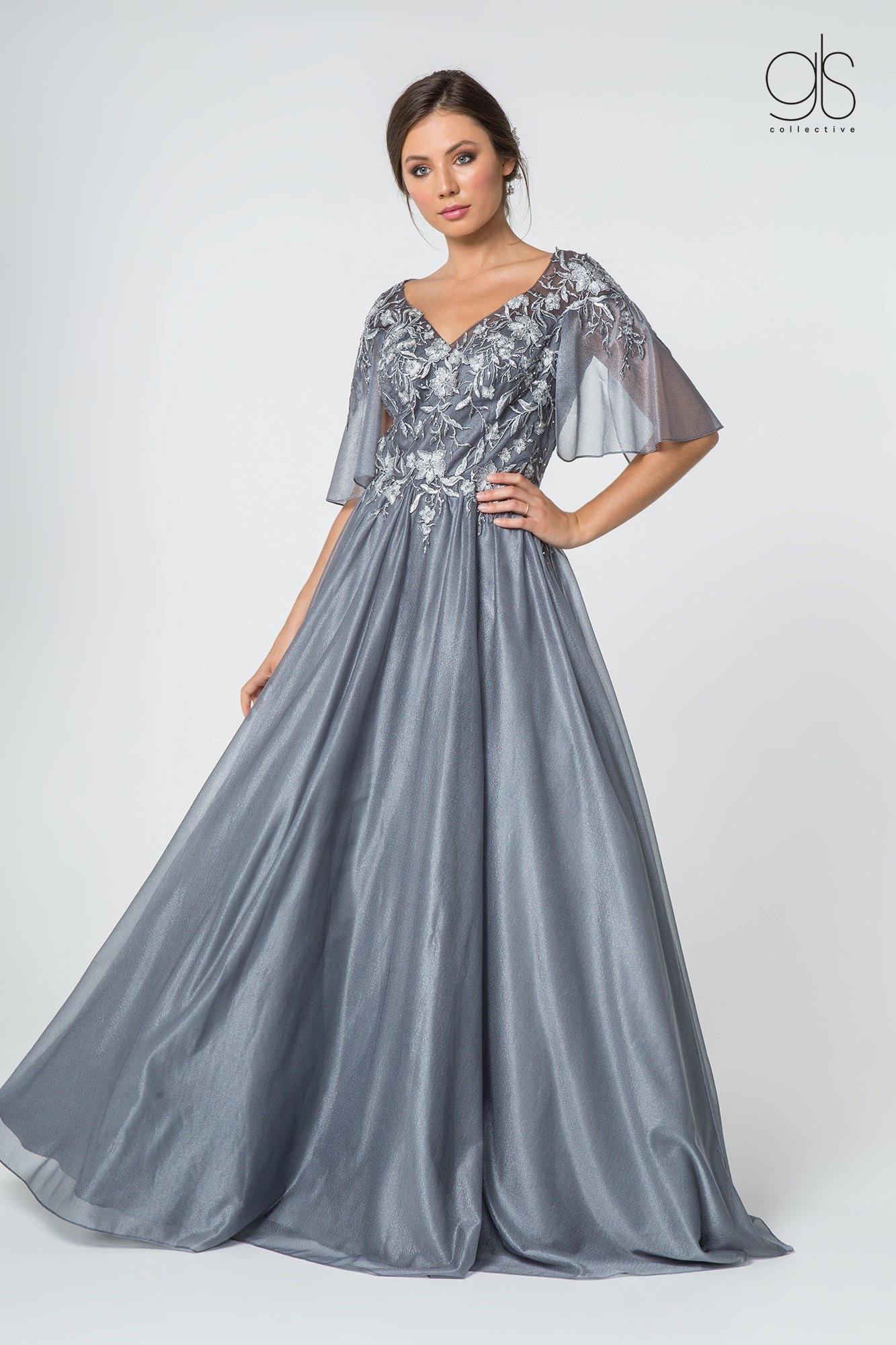 This modest floor length dress features floral lace applique embellished V-neck with cape sleeve. Perfect for formal, evening party or any special occasion.<br><br> <br>Fabric : Chiffon, Lace<br><br>Closure : Zipper Back<br><br>Length : Full Length<br><br>Sleeve Style : Cape Sleeve<br><br>Color : Silver<br><br>Sizes : S, M, L, XL, 2XL<br><br>Fully Lined<br><br>Soft Cup Inserts<br><br>Occasion : Formal, Evening Party, Mother of the Bride, Mother of the Groom, Church, Wedding Guest