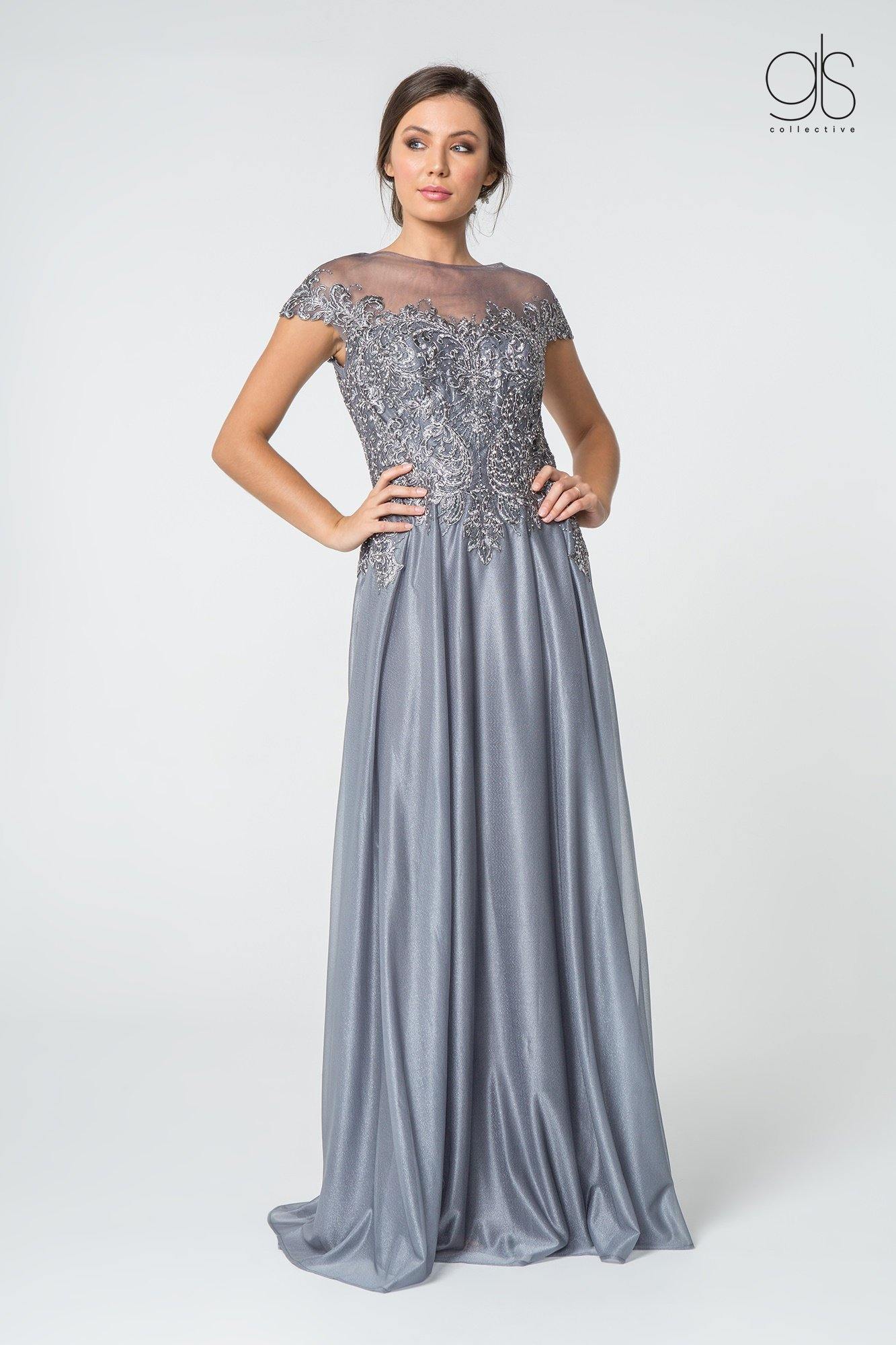 <span data-mce-fragment="1">This Mother of the Bride Dress from The Dress Outlet combines elegance with a modern touch. </span>These modest long dress features cap sleeve with boat neckline. The fitted bodice is adorned with embellishments and is styled with a back keyhole and chiffon skirt material. <span data-mce-fragment="1">Its delicate design and variety of colors create that classy look, while the soft fabric and easy fit promise an effortless look that works well for all occasions.</span><br><br> <br>Fabric : Chiffon, Lace<br><br>Closure : Zipper Back<br><br>Length : Full Length<br><br>Sleeve Style : Cap Sleeve<br><br>Colors : Silver, Burgundy, Navy<br><br>Sizes : S, M, L, XL, 2XL, 3XL, 4XL<br><br>Fully Lined<br><br>Soft Cup Inserts<br><br>Occasion : Formal, Evening Party, Mother of the Bride, Mother of the Groom, Church, Wedding Guest