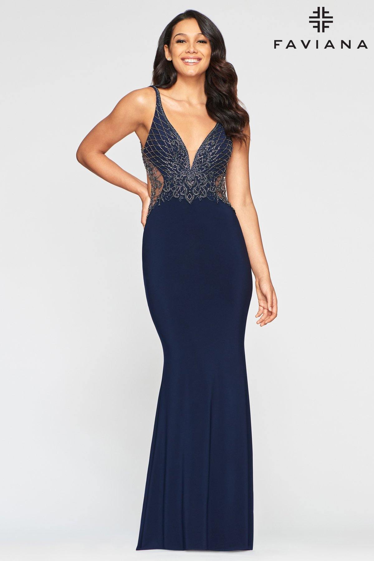 This stunning fitted floor length dress features a sleeveless v-neckline with sheer inset panel. Beaded bodice with back and side cutout. The skirt parades a long sheath silhouette that is perfectly matched with sweep train. Perfect for any occasion. <br><br><br>Fabric : Stretch Jersey<br><br>Closure : Zipper Back<br><br>Length : Full Length<br><br>Sleeve Style : Sleeveless<br><br>Color : Navy<br><br>Sizes : 00, 0, 2, 4, 6, 8, 10, 12<br><br>Fully Lined<br><br>Soft Cup Inserts<br><br>Occasion : Formal, Prom, Homecoming, Wedding Guest, Evening Party, Red Carpet, Pageant, Special Occasion