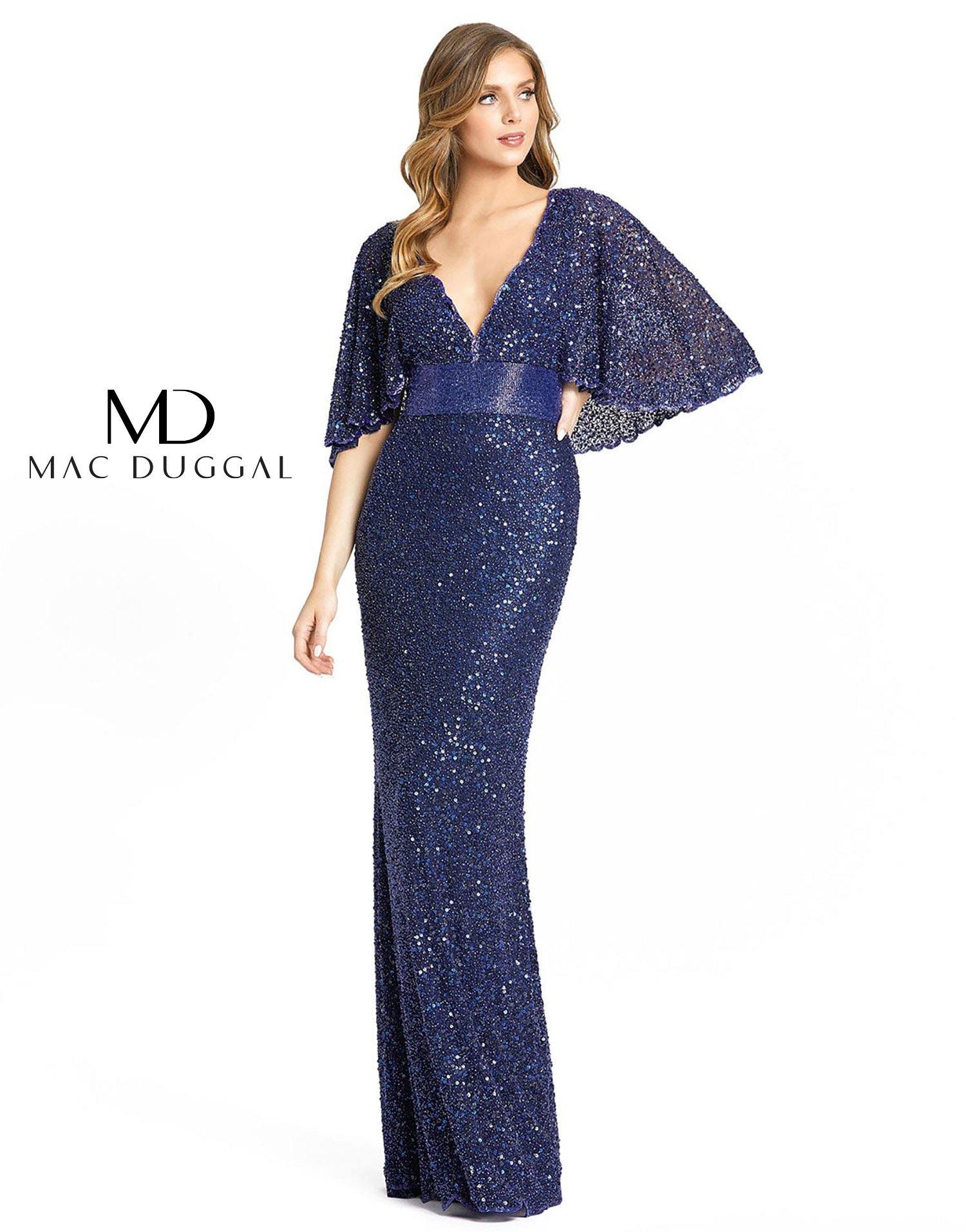 This stunning long dress features a 3/4 cape sleeves and scalloped trims with V-neckline. Decorated with fluid like beaded domain belt the sheath skirt streams incredibly into a broad train. Perfect for any occasion.<br data-mce-fragment="1"><br data-mce-fragment="1"><br data-mce-fragment="1">Fabric : Sequins<br data-mce-fragment="1"><br data-mce-fragment="1">Zipper Back<br data-mce-fragment="1"><br data-mce-fragment="1">Length : Full Length<br data-mce-fragment="1"><br data-mce-fragment="1">Sleeve Style : 3/4 Cape Sleeve<br data-mce-fragment="1"><br data-mce-fragment="1">Colors : Midnight, Wine, Nude/Gold, Forest Green<br data-mce-fragment="1"><br data-mce-fragment="1">Sizes : 2, 4, 6, 8, 10, 12, 14, 16<br data-mce-fragment="1"><br data-mce-fragment="1">Fully Lined<br data-mce-fragment="1"><br data-mce-fragment="1">Soft Cup Inserts<br data-mce-fragment="1"><br data-mce-fragment="1">Occasion : Formal, Prom, Homecoming, Wedding Guest, Red Carpet, Pageant, Special Occasion