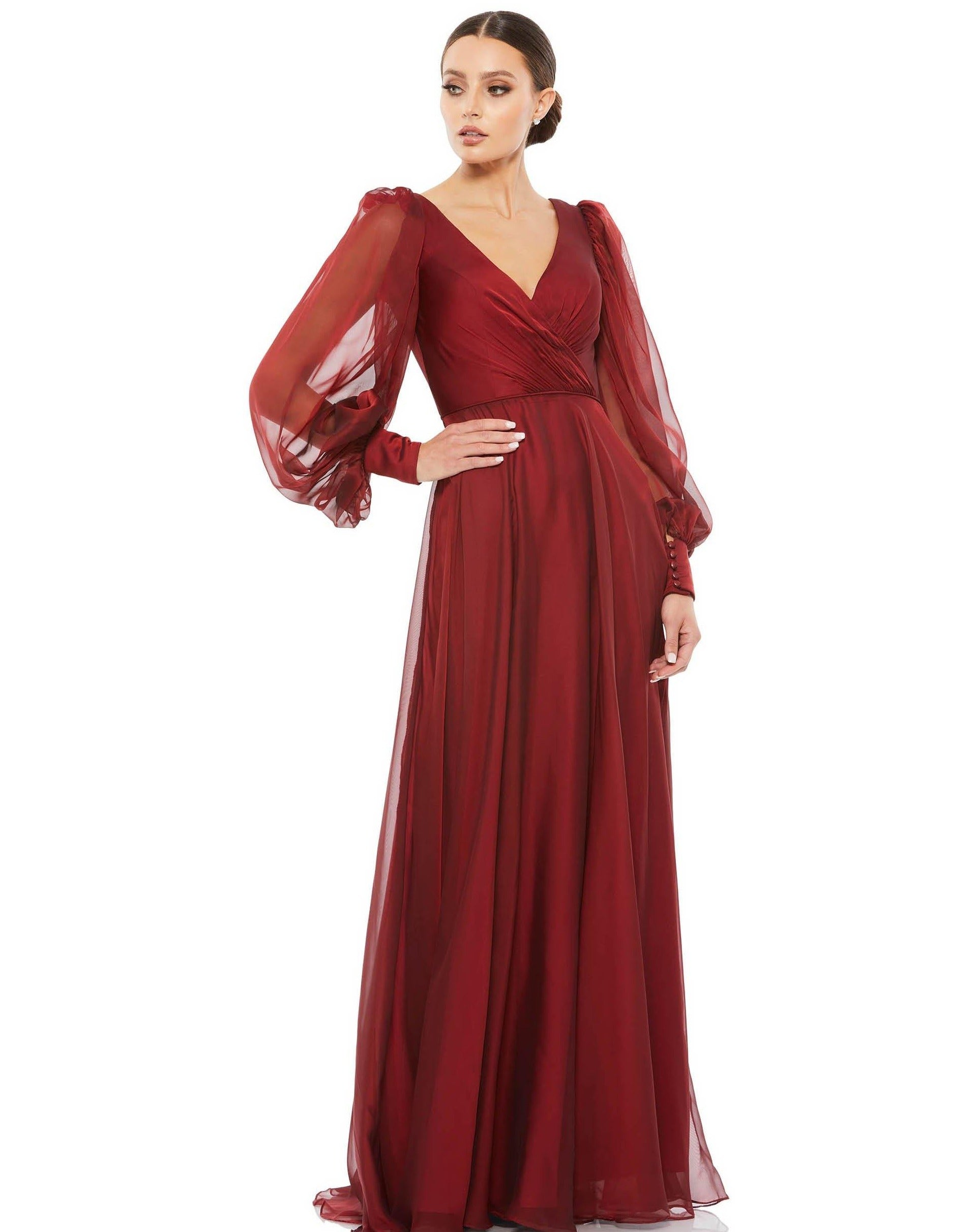 <p> </p> <p><span data-mce-fragment="1">This elegant Mac Duggal wedding guest dress is perfect for a variety of occasions, from weddings to proms and galas. Featuring a long sleeve blosoun style in V-neckline. A-line silhouette in pleated style. The luxurious fabric, impeccable detailing, and flattering silhouette are sure to make you look and feel your best. It is available in various shades of color and has sizes in 2 to 18, so you can find your perfect fit.</span></p> <p> </p> <p>Fabric : Chiffon</p> <p>Zipper Back</p> <p>Length : Full Length</p> <p>Sleeve Style : Long Sleeve</p> <p>Color : Sage, Garnet</p> <p>Sizes : 2, 4, 6, 8, 10, 12, 14, 16, 18</p> <p>Fully Lined</p> <p>Occasion : Formal, Evening Party, Mother of the Bride, Mother of the Groom, Church, Wedding Guest</p>