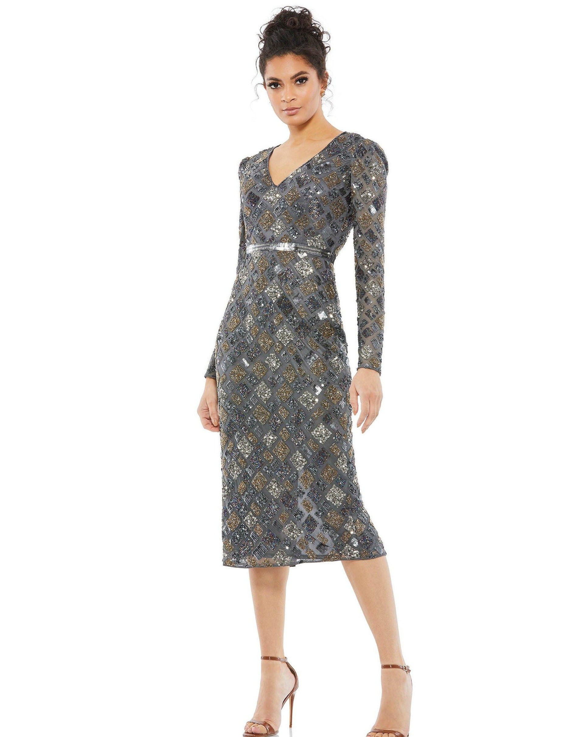 Elegant tea length dress is set with geometric shaped pearls and V-neckline with pearls and see through long sleeves. This figure-hugging shell dress features sequins at the waist and a slit in the center of the back.<br data-mce-fragment="1"><br data-mce-fragment="1"><br data-mce-fragment="1">Fabric : Sequins<br data-mce-fragment="1"><br data-mce-fragment="1">Zipper Back<br data-mce-fragment="1"><br data-mce-fragment="1">Length : Tea Length<br data-mce-fragment="1"><br data-mce-fragment="1">Sleeve Style : Long Sleeve<br data-mce-fragment="1"><br data-mce-fragment="1">Colors : Charcoal, Peach<br data-mce-fragment="1"><br data-mce-fragment="1">Sizes : 2, 4, 6, 8, 10, 12, 14, 16<br data-mce-fragment="1"><br data-mce-fragment="1">Fully Lined<br data-mce-fragment="1"><br data-mce-fragment="1">Occasion : Cocktail, Evening Party, Mother of the Bride, Mother of the Groom, Church, Wedding Guest