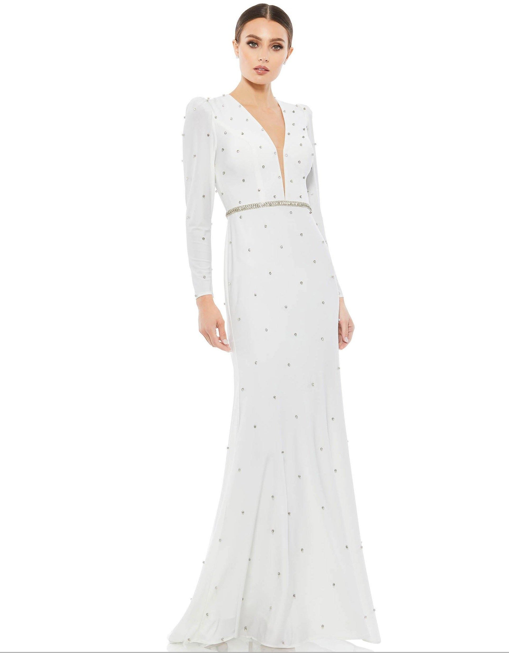 <p>This stunning form fitting evening gown with a sleek silhouette in crystal beaded jersey and clear long sleeves. The sheer pearls at the waist accentuate this dress with a train.</p> <p> </p> <p>Fabric : Jersey</p> <p>Zipper Back</p> <p>Length : Full Length</p> <p>Sleeve Style : Long Sleeve</p> <p>Colors : White, Black / Silver</p> <p>Sizes : 0, 2, 4, 6, 8, 10, 12, 14</p> <p>Fully Lined</p> <p>Occasion : Formal, Evening Party, Mother of the Bride, Mother of the Groom, Church, Wedding Guest</p>