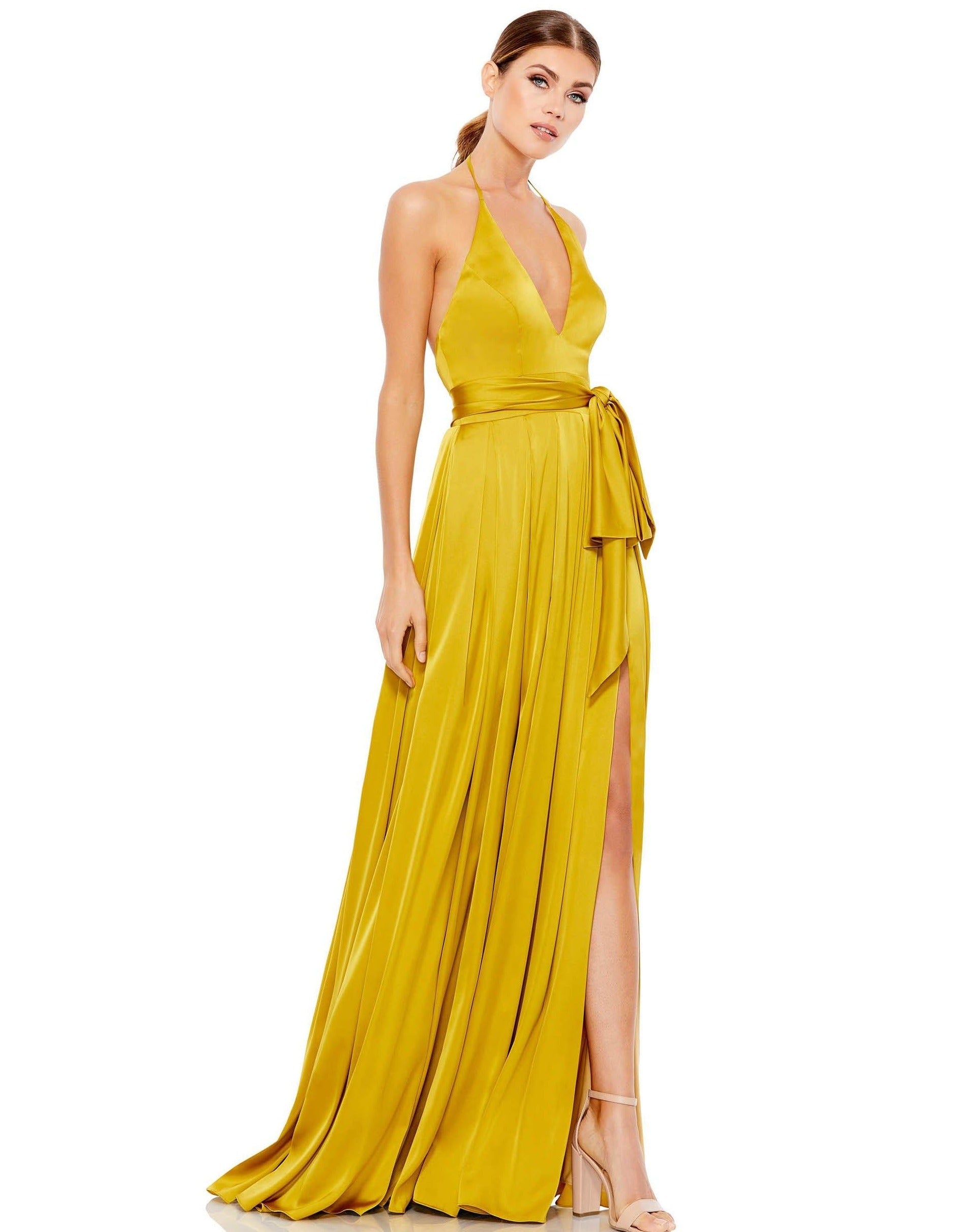 <p>Stunning halter long gown featured with a deep V neckline and an open back. A-line silhouette with a  self-tying sash belt tops the pleated skirt with a thigh high slit and sweep train.</p> <p> </p> <p>Fabric : Satin</p> <p>Zipper Back</p> <p>Length : Full Length</p> <p>Sleeve Style : Halter</p> <p>Colors : Chartreuse, <span data-mce-fragment="1">Magenta, Purple</span></p> <p>Sizes : 0, 2, 4, 6, 8, 10, 12, 14</p> <p>Fully Lined</p> <p>Occasion : Formal, Prom, Homecoming, Wedding Guest, Red Carpet, Pageant</p>