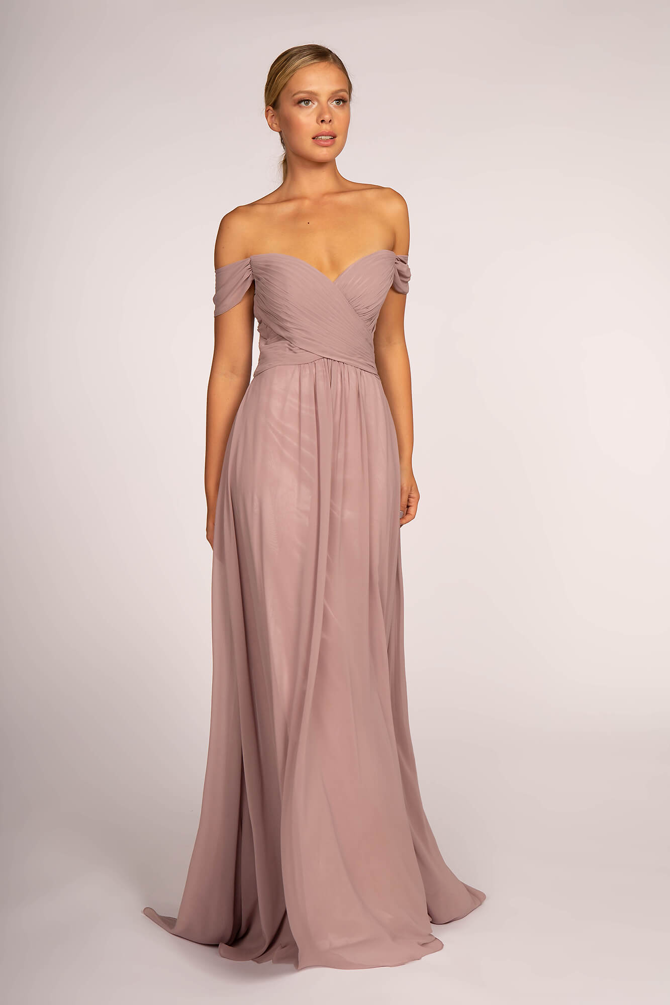 <p><br><span>Charms an off the shoulder neckline with fitted bodice styled in criss cross pleats. The back has a zipper closure while the chiffon skirt fashions a full length A-line silhouette with mini train finish.</span></p> <p> </p> <p><span>Fabric : Chiffon<br><br>Closure : Open Back<br><br>Sleeve Style : Off Shoulder<br><br>Colors : Mauve, Champagne, Sage, Silver Blue<br><br>Sizes : XS, S, M, L, XL, 2XL, 3XL<br><br>Fully Lined<br><br>Occasion : Formal, Prom, Homecoming, Special Occasion</span></p>