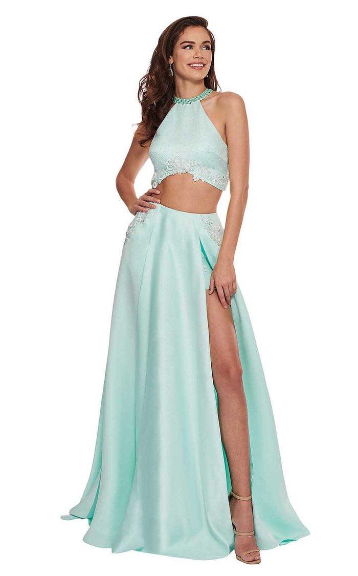 <p>Stylish two piece long gown comes with a high neckline with a bejeweled choker and a floral appliques. The A-line skirt features a racing back and a deep triangular neckline with a double slit in the front revealing mini shorts and a soft skirt.<br></p> <p> </p> <p>Fabric : Satin, Lace Appliques<br></p> <p>Zipper Back</p> <p>Length : Full Length</p> <p>Sleeve Style : Halter</p> <p>Colors : Mint, Pink</p> <p>Sizes : 0, 4, 6, 10, 12<br></p> <p>Fully Lined</p> <p>Occasion : Prom, Formal, Homecoming, Wedding Guest, Red Carpet, Pageant</p>