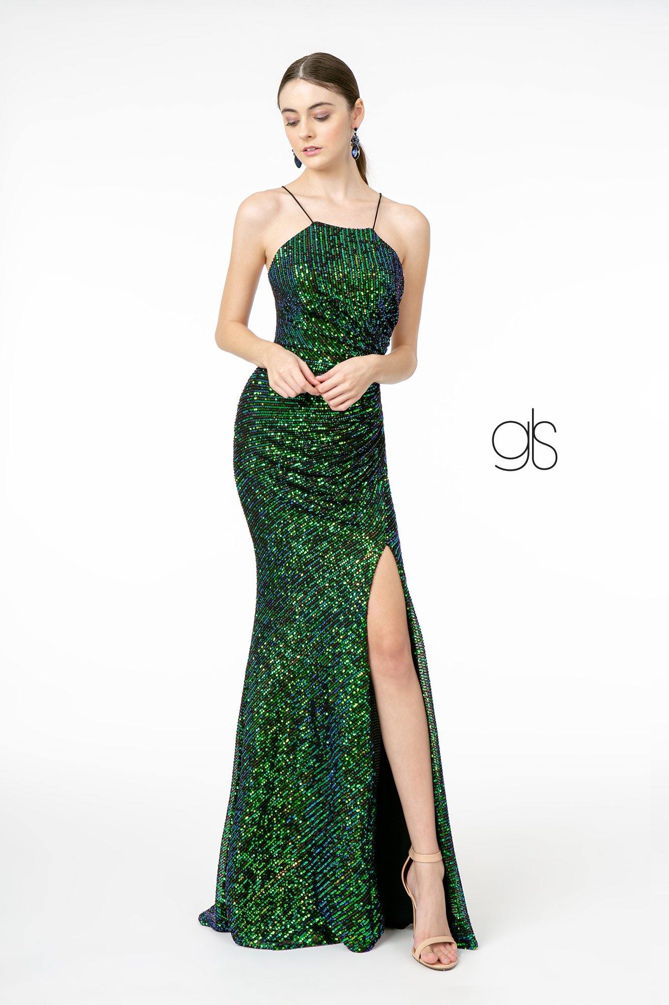 <p> </p> <p><span data-mce-fragment="1">If you're looking for the perfect prom dress that's both affordable and beautiful, then look no further than The Dress Outlet. Features a spaghetti straps halter neckline. Floor length embellished sequin and glitter fitted gown with leg slit. This elegant dress comes in a variety of colors and sizes ranging from small to plus size, and it will make you feel like a princess for the night. The versatile design of the dress allows for it to be worn for a formal or informal event, as well as in any season! </span></p> <p> </p> <p>Fabric : Sequin</p> <p>Length : Floor Length</p> <p>Sleeve Style : Spaghetti Strap</p> <p>Complimentary Matching Shawl is Included</p> <p>Colors : Green, Navy Blue</p> <p>Sizes : XS, S, M, L, XL, 2XL, 3XL</p> <p>Fully Line</p> <p>Soft Cup Inserts</p> <p>Occasion : Formal, Prom, Homecoming, Evening Party</p>