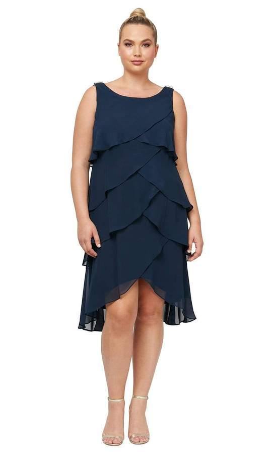 <p> </p> <p><span size="4" data-mce-fragment="1" rwr="1"><span data-mce-fragment="1"><span size="3" data-mce-fragment="1">This elegant short dress features a scoop neckline and a subtly scooped back. The cascading skirt shows a tailored tulip layered detail with a short high low hem.</span></span></span></p> <p> </p> <p><strong>Fabric</strong> : Chiffon </p> <p><span size="4" data-mce-fragment="1" rwr="1"><span data-mce-fragment="1"><span size="3" data-mce-fragment="1"><strong data-mce-fragment="1">Length</strong> : Asymmetrical Hem/High Low</span></span></span></p> <p><span size="4" data-mce-fragment="1" rwr="1"><span data-mce-fragment="1"><span size="3" data-mce-fragment="1"><strong data-mce-fragment="1">Sleeve Style</strong> : Sleeveless</span></span></span></p> <p><span size="4" data-mce-fragment="1" rwr="1"><span data-mce-fragment="1"><span size="3" data-mce-fragment="1"><strong data-mce-fragment="1">Colors</strong> : Navy, Steel, Black, Fig, Cashmere, Iris, Mid Teal</span></span></span></p> <p><span size="4" data-mce-fragment="1" rwr="1"><span data-mce-fragment="1"><span size="3" data-mce-fragment="1"><strong data-mce-fragment="1">Sizes </strong>: 14W, 16W, 18W, 20W, 22W, 24W</span></span></span></p> <p><span size="4" data-mce-fragment="1" rwr="1"><span data-mce-fragment="1"><span size="3" data-mce-fragment="1"><strong data-mce-fragment="1">Fully Lined</strong></span></span></span></p> <p><span size="4" data-mce-fragment="1" rwr="1"><span data-mce-fragment="1"><span size="3" data-mce-fragment="1"><strong data-mce-fragment="1">Occasion</strong> : Formal, Evening Party, Church, Wedding Guest, Dinner Party, Special Occasion</span></span></span></p>