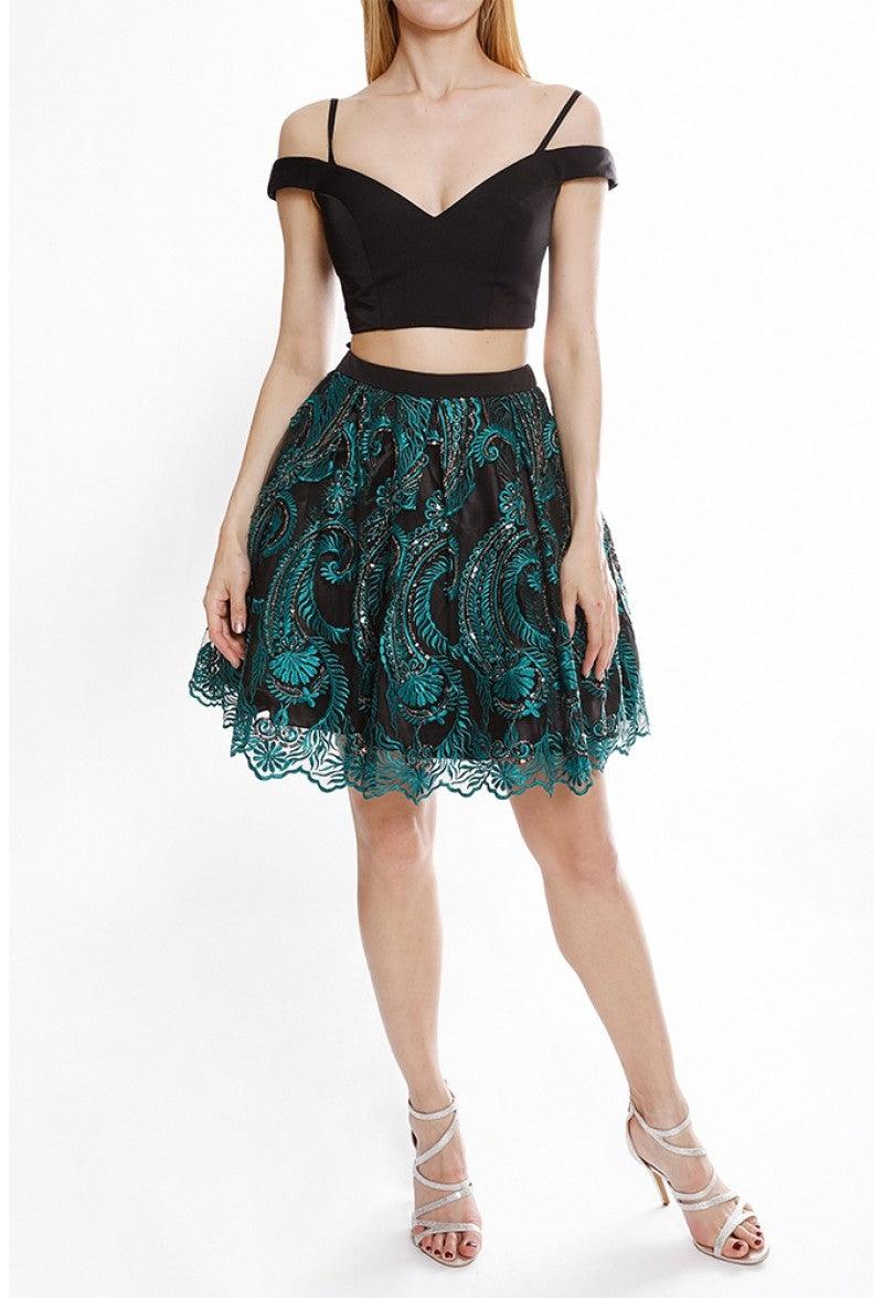 <p> </p> <p>This fun and flirty two-piece dress features <span data-mce-fragment="1">an off shoulder neckline with a deep v-notch and a mid-open back. Defined with a slender waistband, the skirt is overlaid with a bead-detailed embroidered flare that ends in a scalloped short hem. This is</span> perfect for any special occasion.</p> <p><br></p> <p>Length : Above the knee</p> <p>Sleeve Style : Off shoulder</p> <p>Color : Ivory Black</p> <p>Sizes : 2, 4, 6, 8, 10, 12, 14, 16, 18, 20, 22, 24</p> <p>Fully Lined</p> <p>Occasion : Formal, Prom, Homecoming, Wedding Guest, Red Carpet, Pageant, Special Occasion</p>