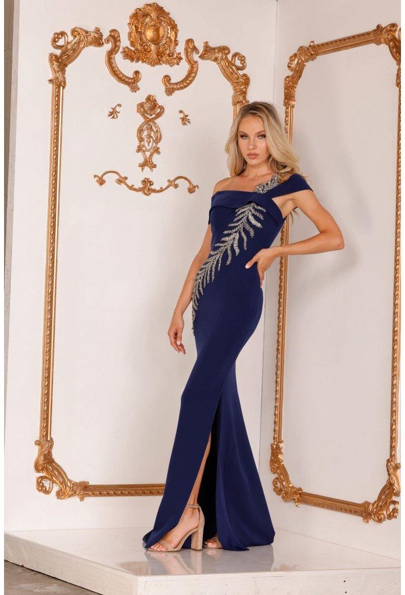 <p> </p> <p><span data-mce-fragment="1">This elegant long dress features an off shoulder asymmetrical neckline. Trumpet cut has asymmetrical crystal embellishments and a glamorous side slit. This dress is perfect for any occasion.</span></p> <p> </p> <p><span data-mce-fragment="1">Length : Full Length</span><br data-mce-fragment="1"><br data-mce-fragment="1"><span data-mce-fragment="1">Sleeve Style : Off Shoulder</span><br data-mce-fragment="1"><br data-mce-fragment="1"><span data-mce-fragment="1">Color : Navy, Silver</span><br data-mce-fragment="1"><br data-mce-fragment="1"><span data-mce-fragment="1">Sizes : 2, 4, 6, 8, 10, 12, 14, 16, 18, 20, 22, 24</span><br data-mce-fragment="1"><br data-mce-fragment="1"><span data-mce-fragment="1">Fully Lined</span><br data-mce-fragment="1"><br data-mce-fragment="1"><span data-mce-fragment="1">Occasion : Formal, Prom, Homecoming, Wedding Guest, Red Carpet, Pageant, Special Occasion</span></p>